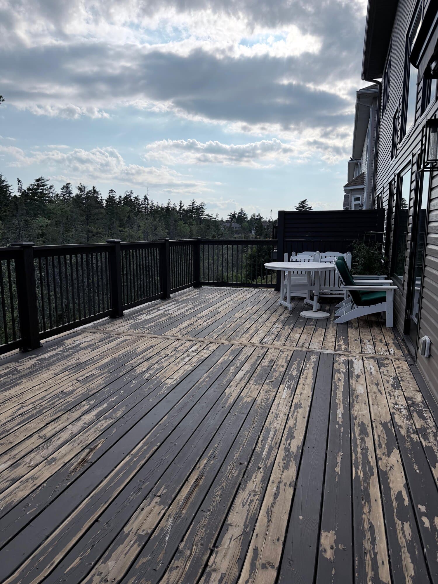 Weathered deck with heavily peeling stain before ProMax refinishing